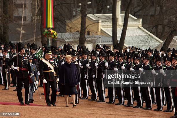 King Harald V of Norway and Lithuania's President Dalia Grybauskaite inspect the King's Guard during the official welcoming ceremony at the Royal...