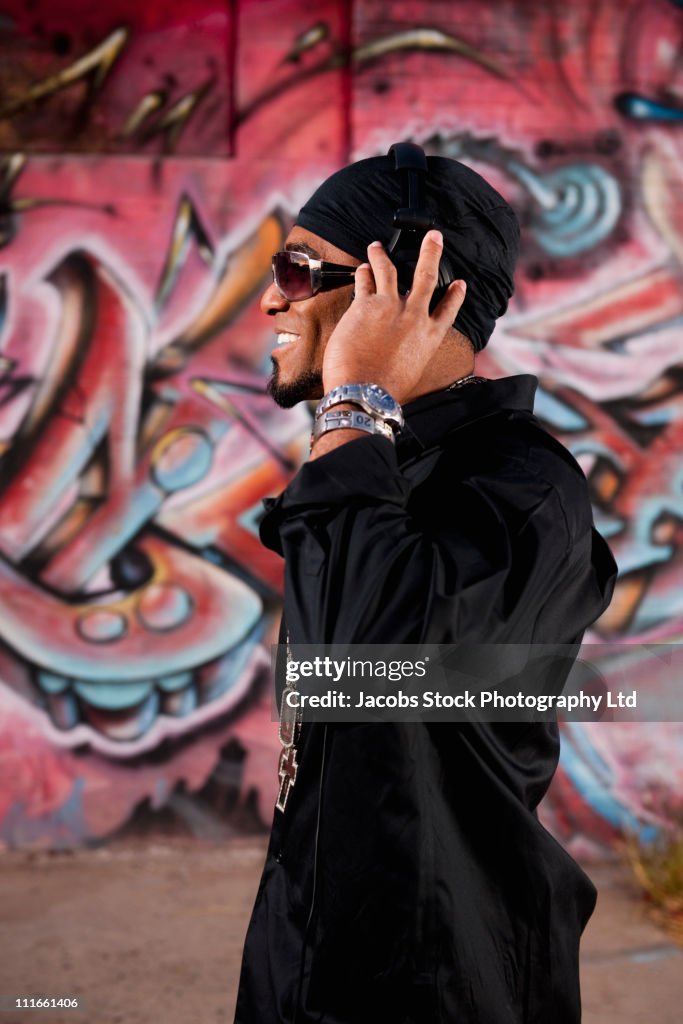 Hip African American man listening to headphones