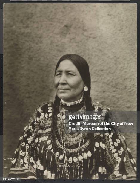 Portrait of a Native American chief's wife, Mrs. Medicine Owl, at the McAlpin Hotel, New York, New York, 1913.