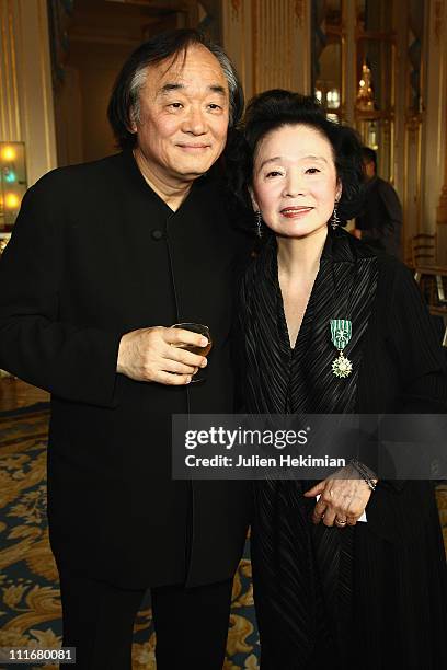 Yoon Jeong-hee is pictured with her husband Kun Wu Paik after being awarded at Ministere de la Culture on April 5, 2011 in Paris, France.