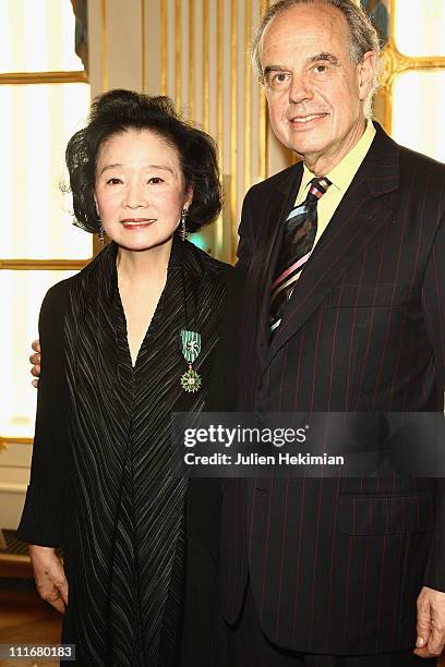 Yoon Jeong-hee is pictured with French Minister of Culture Frederic Mitterrand after being awarded at Ministere de la Culture on April 5, 2011 in...