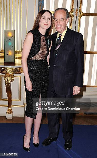 Elsa Zylberstein and French Minister of Culture Frederic Mitterrand pose after she receives the medal "Chevalier des Arts et des lettres" at...