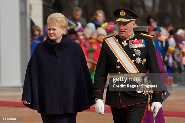 Lithuania's president Dalia Grybauskaite and King Harald V of Norway attend the official welcoming ceremony at the Royal Palace on the first day of...