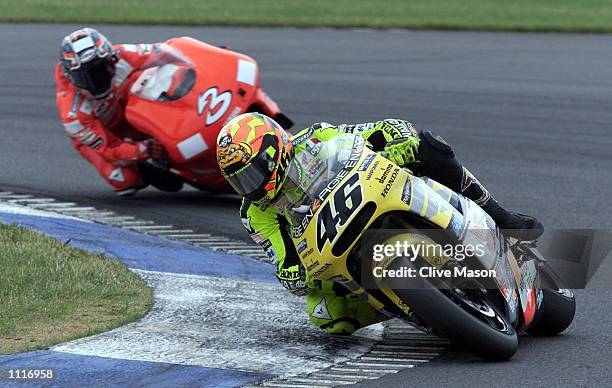 Valentino Rossi of Italy and Honda in action leading Max Biaggi of Italy and Yamaha during the British Motorcycle Grand Prix at Donington Park,...