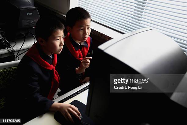 North Korean children learn to use the computer in a primary school on April 2, 2011 in Pyongyang, North Korea. Pyongyang is the capital city of...