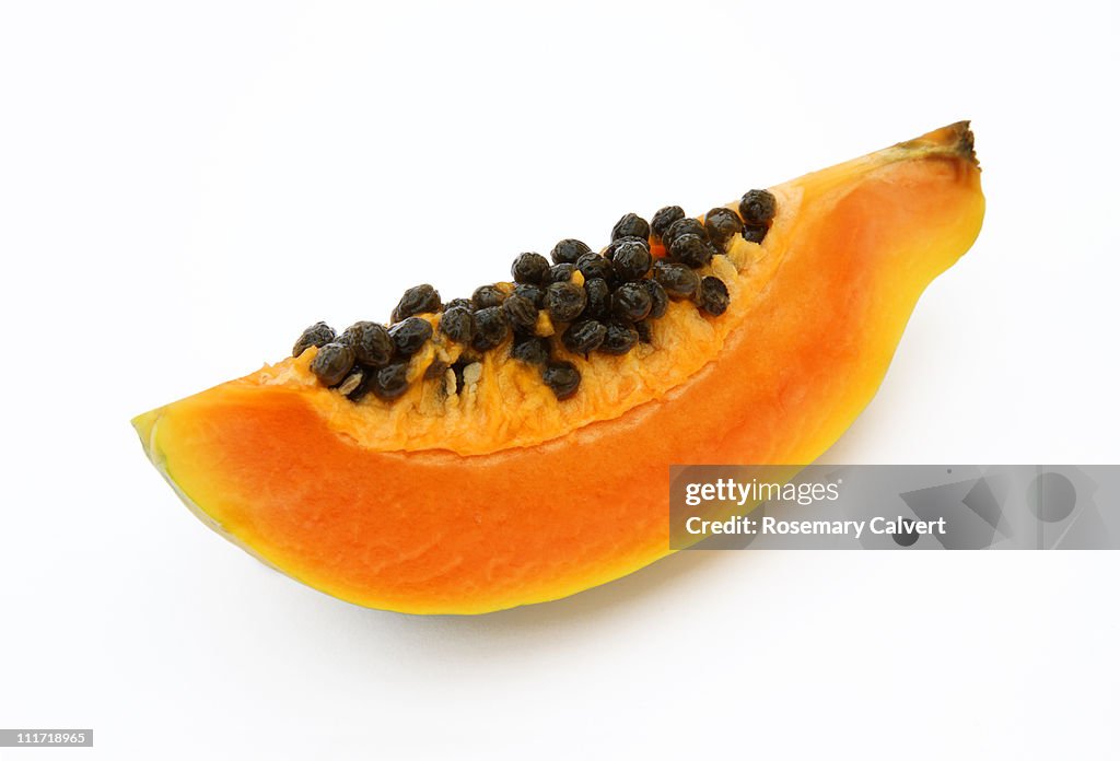 Quarater of a fresh, ripe papaya or paw paw.