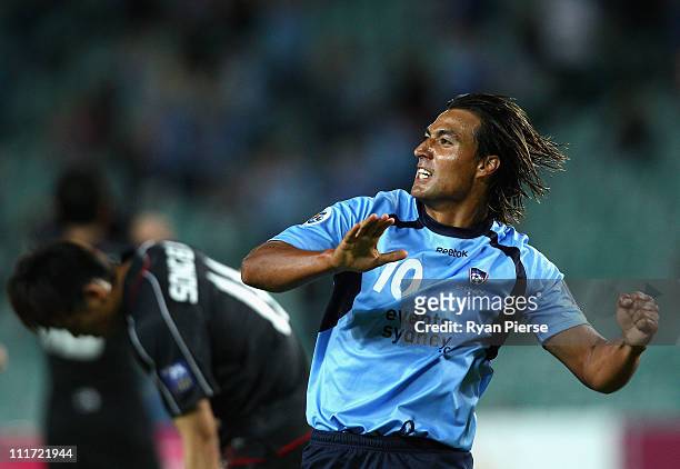 Nick Carle of Sydney celebrates after scoring his teams first goal during the group H ACF Champions League match between Sydney FC and Shanghai...