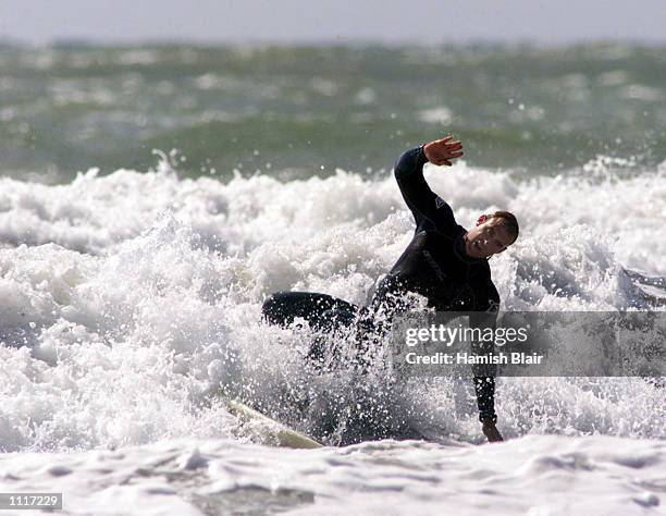 Matthew Hayden of Australia takes a tumble while surfing in Croyde Bay, England. DIGITAL IMAGE Mandatory Credit: Hamish Blair/ALLSPORT