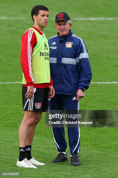 Michael Ballack and head coach Jupp Heynckes talk during a Bayer Leverkusen training session at BayArena training ground on April 6, 2011 in...