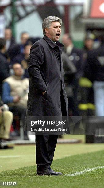 Milan coach Carlo Ancelotti watches the action during the Serie A match between AC Milan and Parma, played at the San Siro Stadium, Milan. DIGITAL...