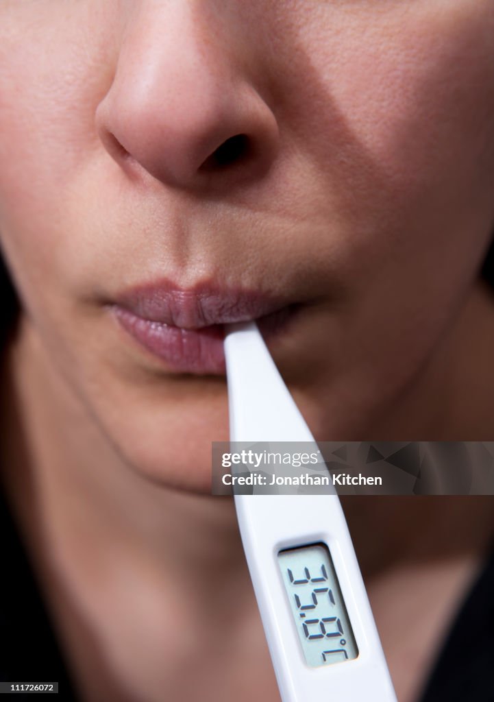 Woman taking Temperature