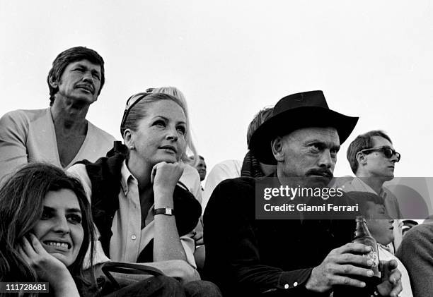 Yul Brynner and his wife Doris Kleiner on the farm 'La Paz' of the bullfighter Luis Miguel Dominguin attend a bullfight Cuenca, Spain.