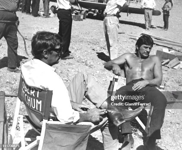 Robert Mitchum and Charles Bronson during a break from filming the movie 'Villa Rides', near Madrid, directed by Buzz Kulik Madrid, Spain. .