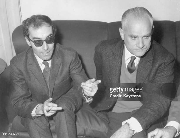 Jean-Luc Godard, director of the film 'Le Mepris' and Alberto Moravia, the Italian writer on whose novel the film is based, during a press conference...