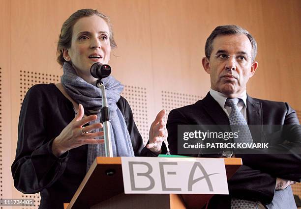 France's Environment and Transport Minister Nathalie Kosciusko-Morizet , flanked by Transport Junior Minister Thierry Mariani, speaks on April 4,...