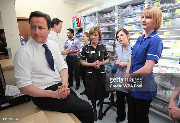 Prime Minister David Cameron speaks with medical staff at Frimley Park Hospital on April 6, 2011 in Frimley, England. Cameron and Deputy Prime...