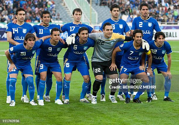 Iran's Esteghlal players pose before an AFC Champions League group B football match against Uzbekistan's Pakhtakor at Azadi stadium in Tehran on...