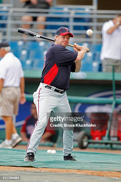 Batting coach Joe Vavra of the Minnesota Twins hits grounders during batting practice before the game against the Boston Red Sox at a Spring Training...