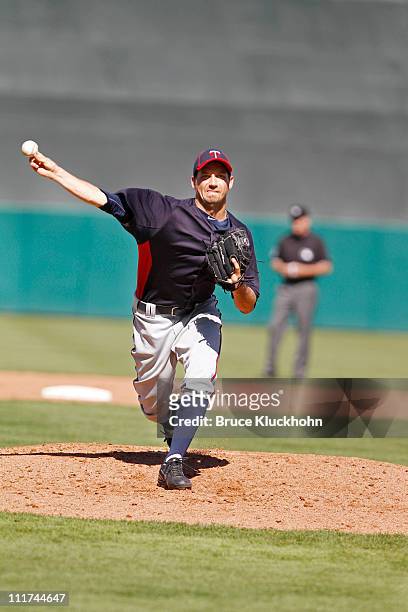 Anthony Slama of the Minnesota Twins warms up to pitch against the Boston Red Sox at a Spring Training game February 28, 2011 at City of Palms Park...