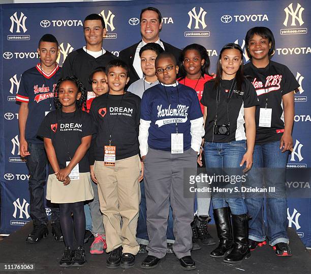 New York Yankee Mark Teixeira with kids from Harlem RBI attends a press conference to launch New York Yankees' Mark Teixeira's "Dream Team" campaign...