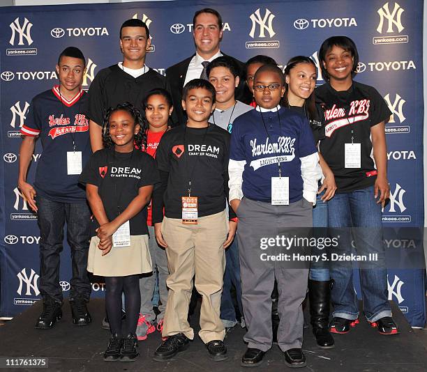 New York Yankee Mark Teixeira with kids from Harlem RBI attends a press conference to launch New York Yankees' Mark Teixeira's "Dream Team" campaign...