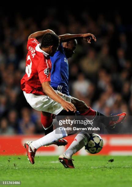 Ramires of Chelsea is brought down by Patrice Evra of Manchester United during the UEFA Champions League quarter final first leg match between...