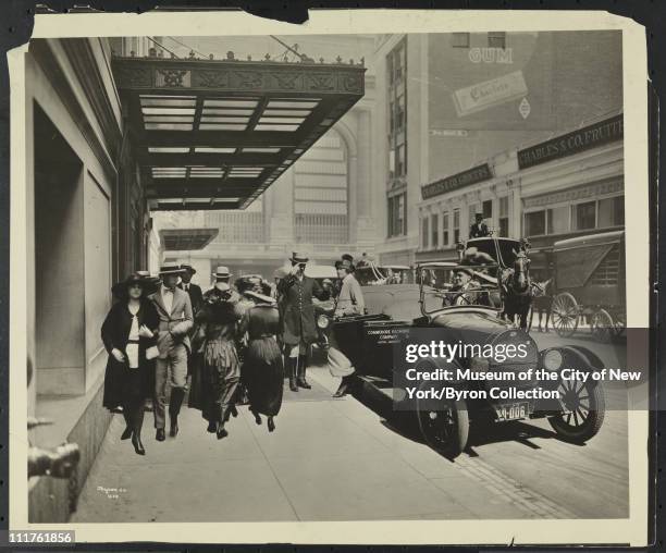 Photomontage which adds pedestrians, a car, doorman and horse-pulled carriage to the 43rd Street entrance to the Biltmore Hotel, New York, New York,...