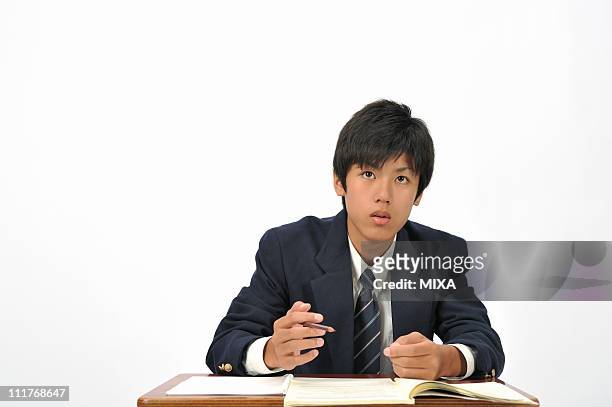 high school boy studying - japanese school uniform stock pictures, royalty-free photos & images