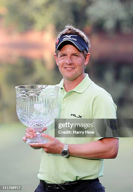 Luke Donald of England poses with the trophy after his score of five-under par won the Par 3 Contest prior to the 2011 Masters Tournament at Augusta...