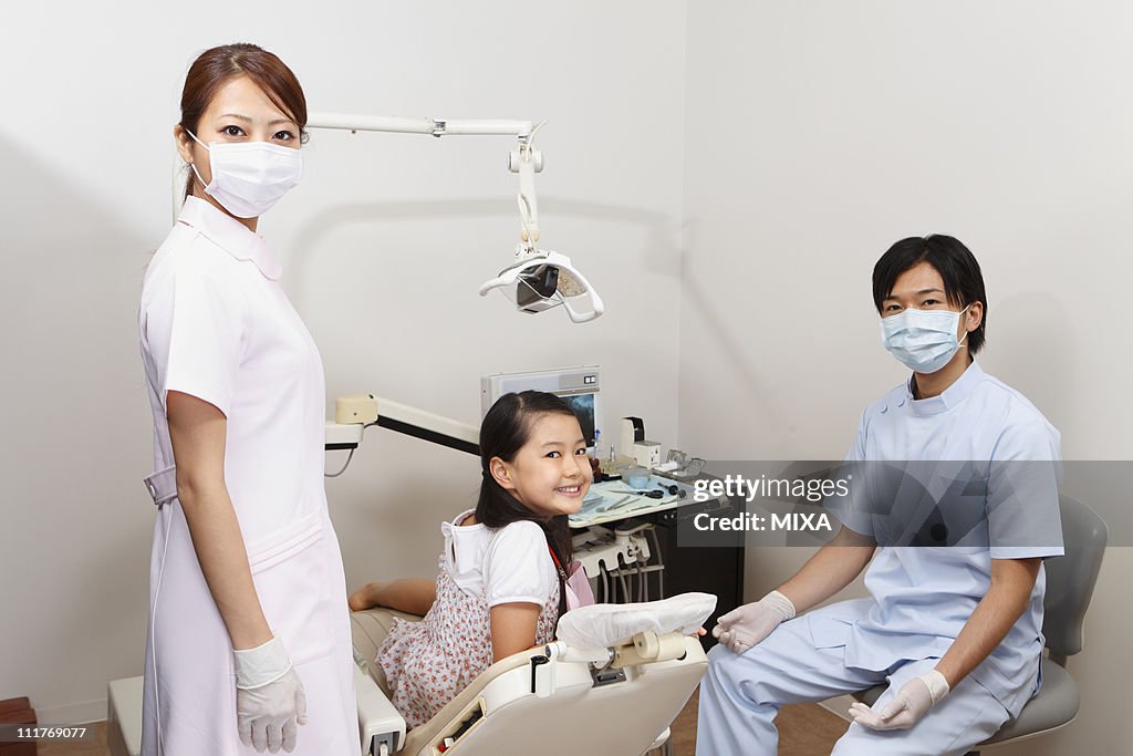 Dentists and Girl Smiling