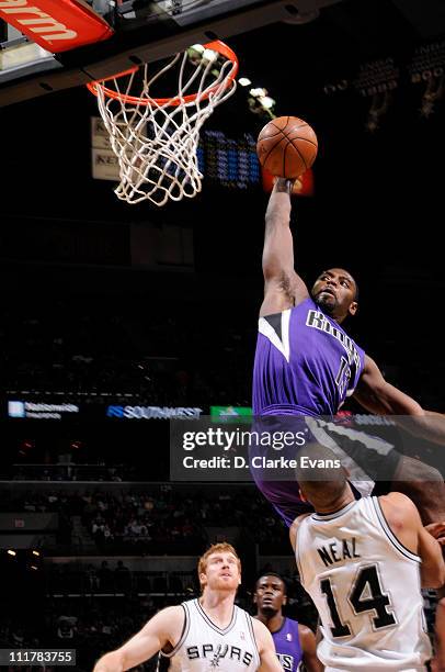 Tyreke Evans of the Sacramento Kings dunks over Gary Neal of the San Antonio Spurs on April 6, 2011 at AT&T Center in San Antonio, Texas. NOTE TO...