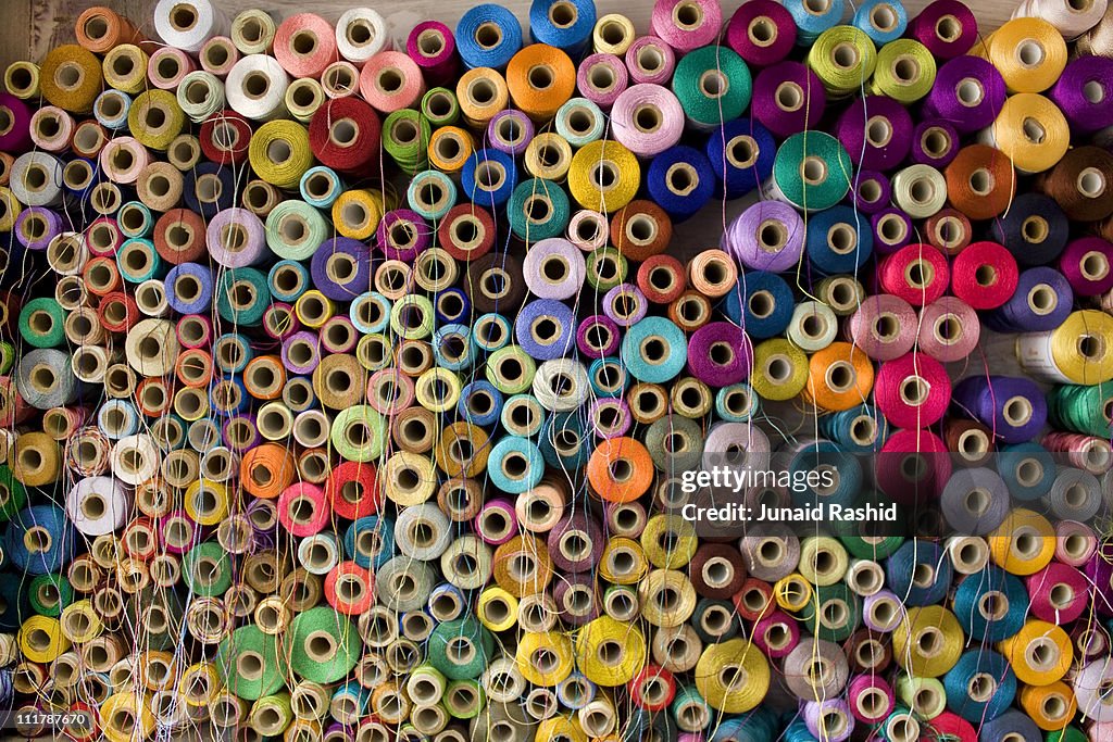 Colorful stack of Pakistan's Cotton Thread Reels