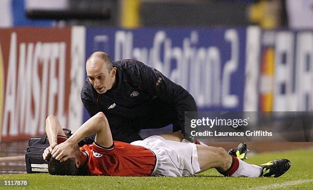 Roy Keane of Man Utd is lies injured during the Deportivo La Coruna v Manchester United UEFA Champions League Quarter Final 1st Leg match at the...