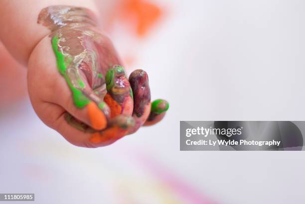 baby painting - baby paint hand stock-fotos und bilder