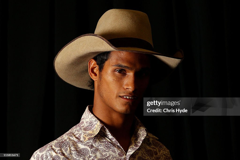 Anthony Thomas poses for a photograph before competing in the... News ...
