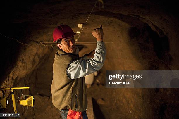 Mexican archaeologist Sergio Gomez gives some explanations inside a tunnel found under the ruins of the Feathered Serpent temple at the...