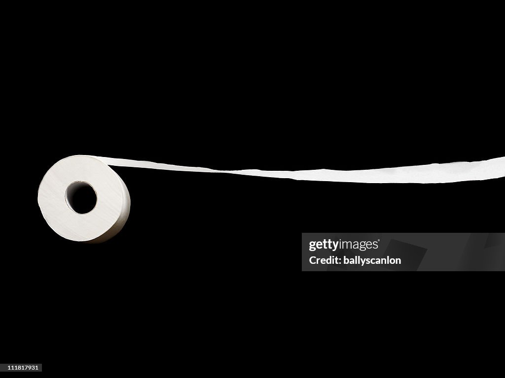 Roll Of Toilet Paper On A Black Background.