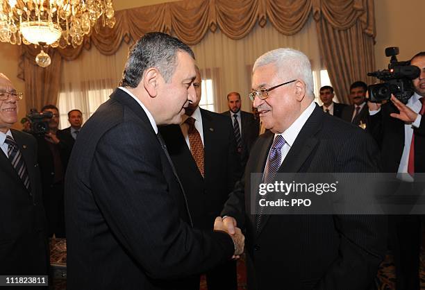 In this handout image supplied by the office of the Palestinian President , President Mahmoud Abbas meets Egyptian Prime Minister Essam Sharaf, on...