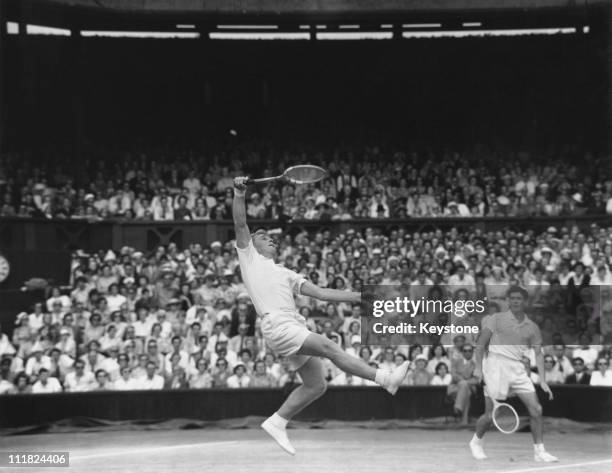 Australian tennis players Lew Hoad and Ken Rosewall competing in a Men's Doubles match against Mervyn Rose and Rex Hartwig at Wimbledon, London, 4th...