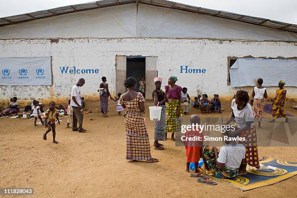 Refugees live in a refugee camp and transit centre, now temporary home to thousands of Ivorian refugees who have fled advancing forces loyal to...