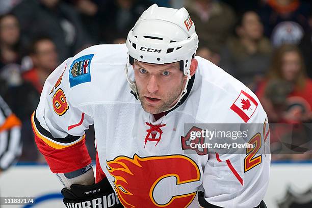 Robyn Regehr of the Calgary Flames watches the face-off during a game against the Edmonton Oilers at Rexall Place on March 26, 2011 in Edmonton,...