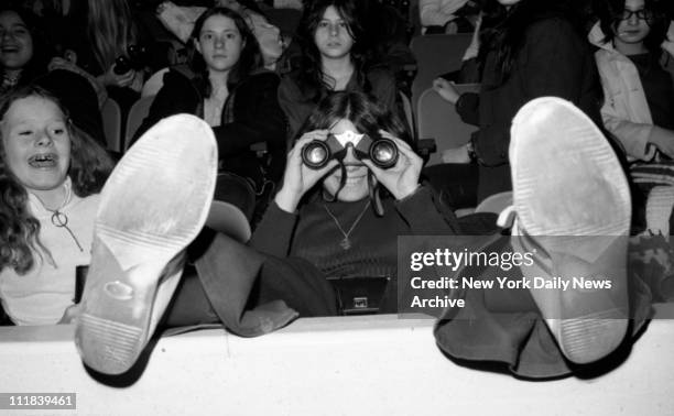 Fans of Rock star David Cassidy in concert at Madison Square Garden. Too great to be missed? She's got binoculars and a tape recorder.