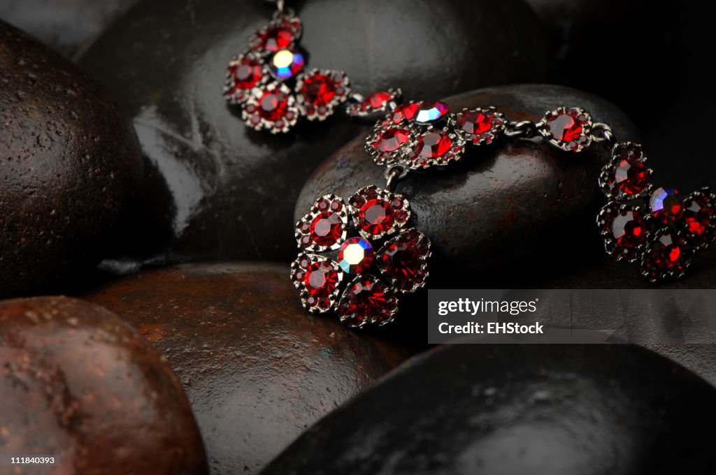 Rubies Necklace on wet Stones