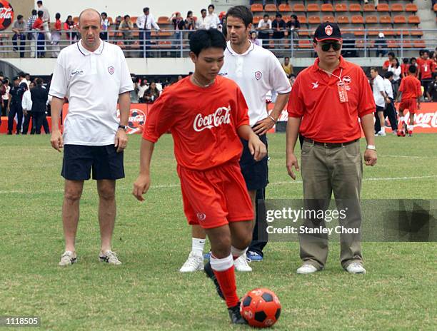 Gary McAllister and Jamie Redknapp of Liverpool conducting a Football Clinic for Young Thai Footballers at the National Stadium in Bangkok during...