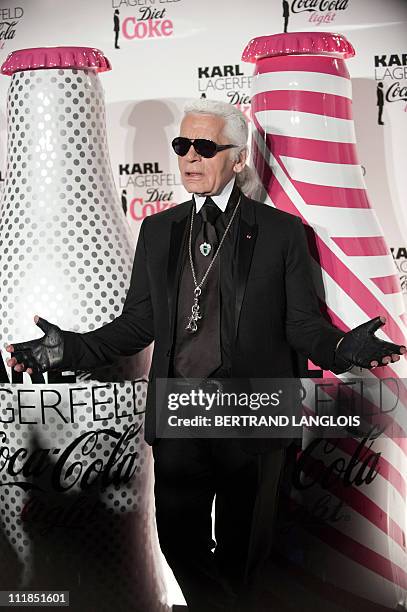 German fashion designer and photographer Karl Lagerfeld poses during the launch party of Coke diet in Paris on April 7, 2011. AFP PHOTO BERTRAND...