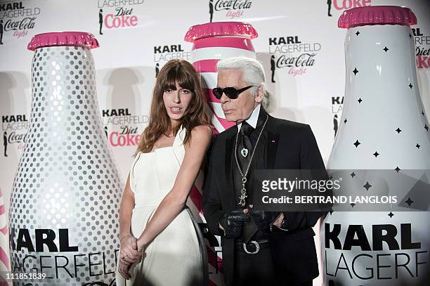German fashion designer and photographer Karl Lagerfeld poses with French actress Lou Doillon during the launch party of Coke diet in Paris on April...