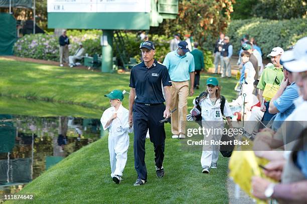 Masters Preview: Jim Furyk walking with his daughter Caleigh Lynn and son Tanner James during Par 3 Contest on Wednesday at Augusta National....