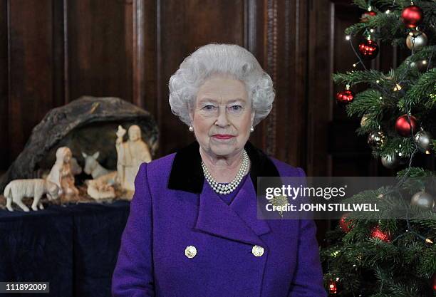 Britain's Queen Elizabeth II poses for a photograph after recording her Christmas Day broadcast to the Commonwealth, in the Chapel Royal, at Hampton...