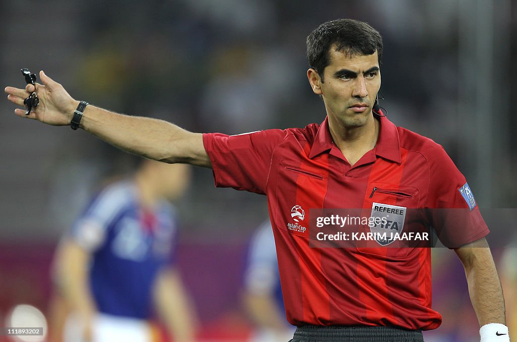 Uzbek referee Ravshan Irmatov gestures d