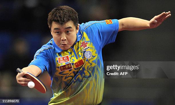 Wang Hao of China returns to Ma Lin of China during the Men's Semi Final of the English Open Table Tennis competition in Sheffield, England on...